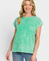 Woman wearing a green t-shirt with a pocket on a white background