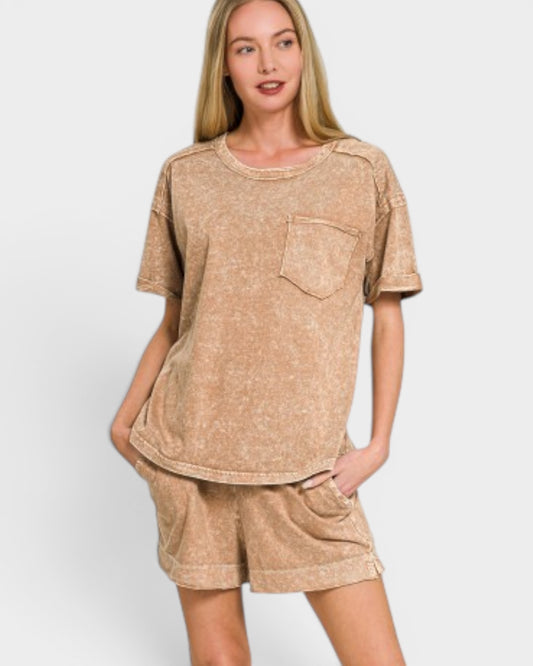 Woman wearing a beige t-shirt and shorts set on a white background