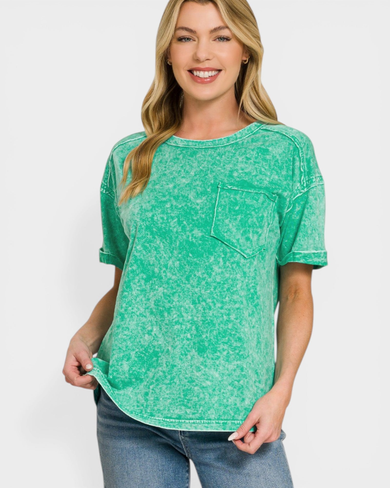 Woman wearing a green t-shirt with a pocket on a white background