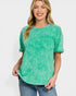 Woman wearing a green t-shirt with a pocket on a white background