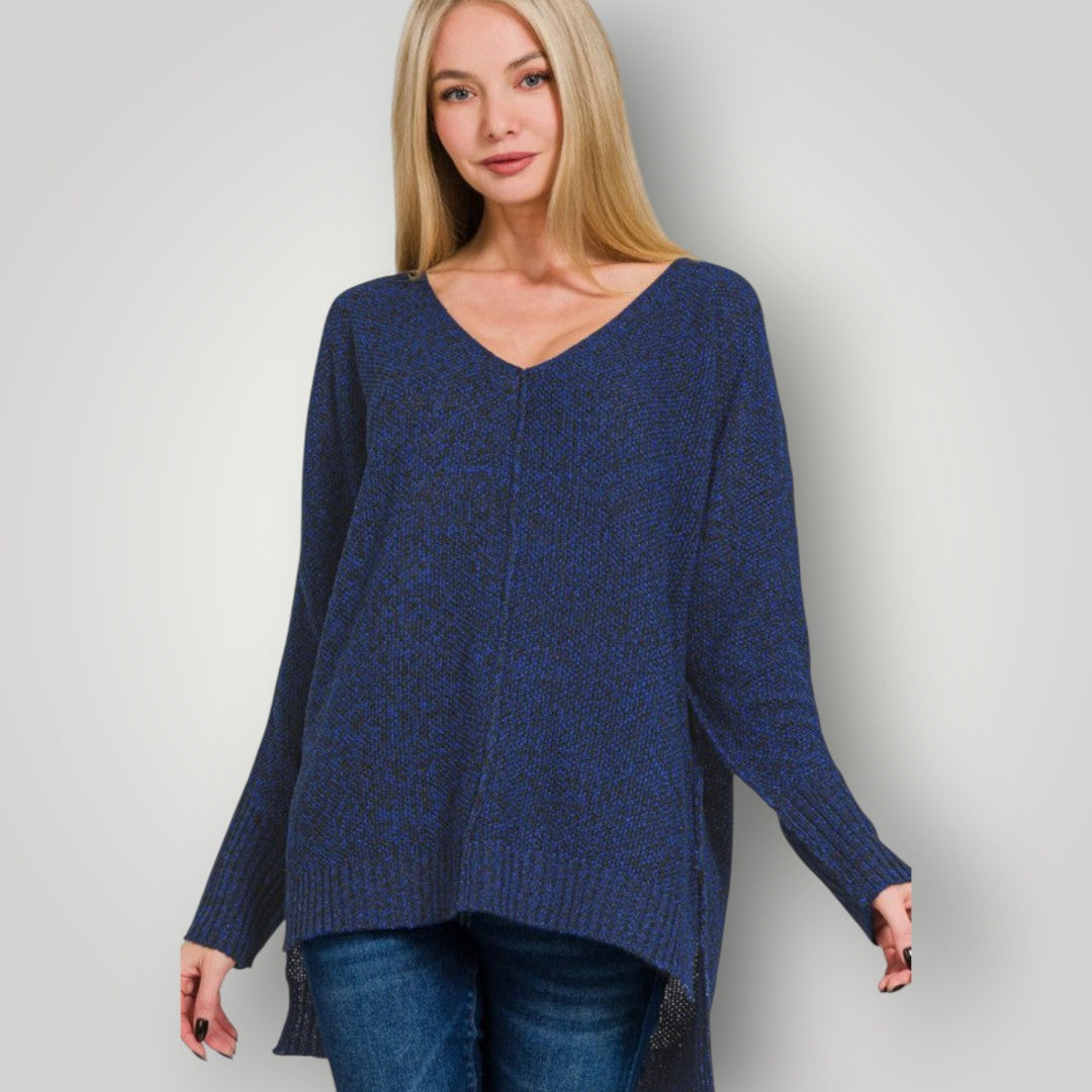 Woman wearing a blue sweater against a plain background