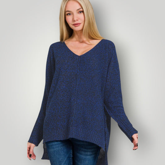 Woman wearing a blue sweater against a plain background