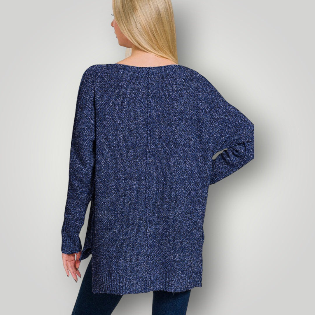 Person wearing a blue knitted cardigan against a plain background