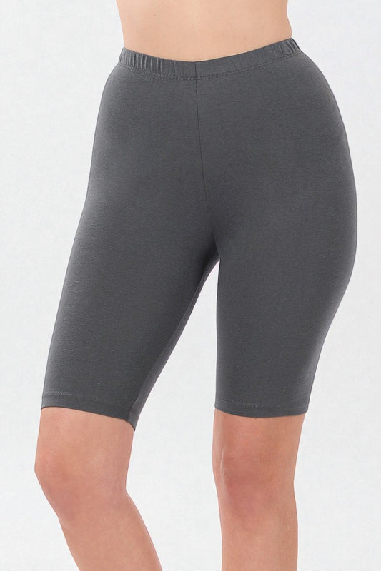 Person wearing gray shorts on a white background