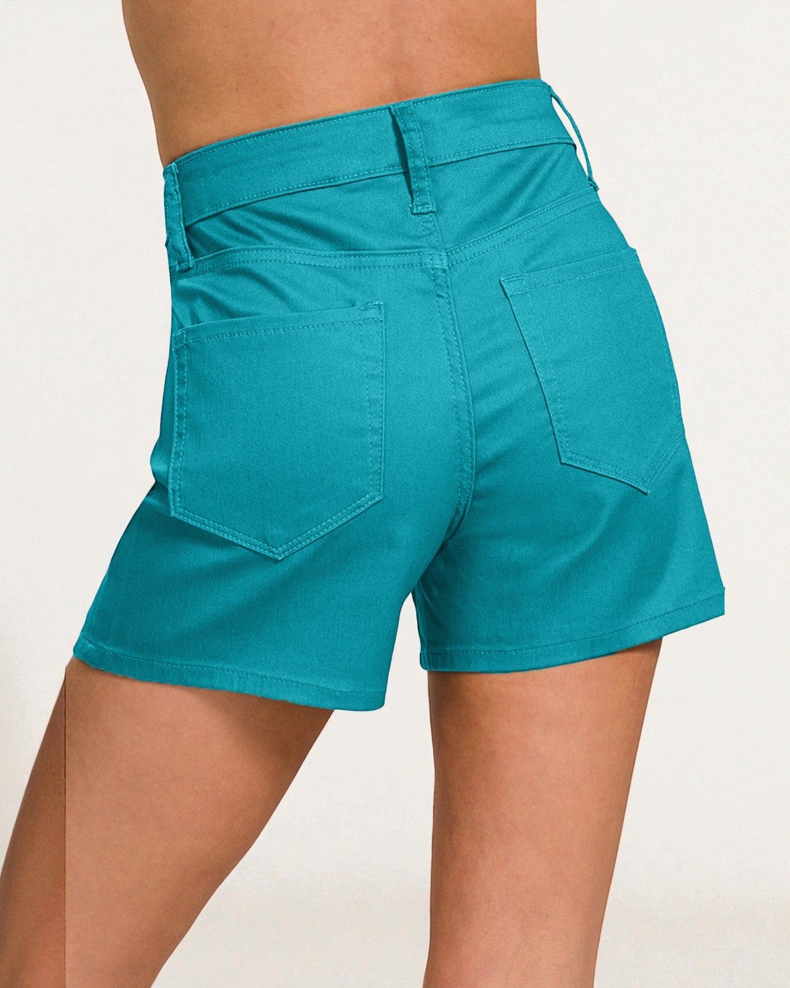 Teal shorts worn by a person on a white background