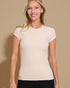 Woman wearing a beige t-shirt against a beige background