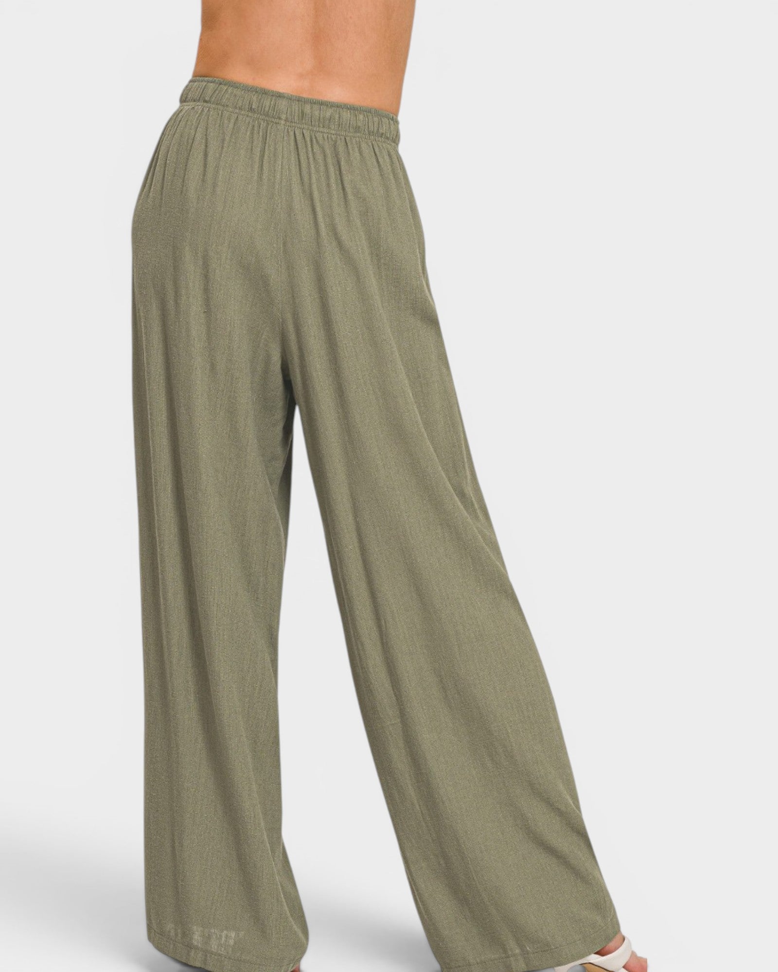 Green wide-leg pants on a white background