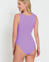 Woman wearing a purple swimsuit against a white background