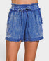 Blue denim shorts with a tie waist on a white background