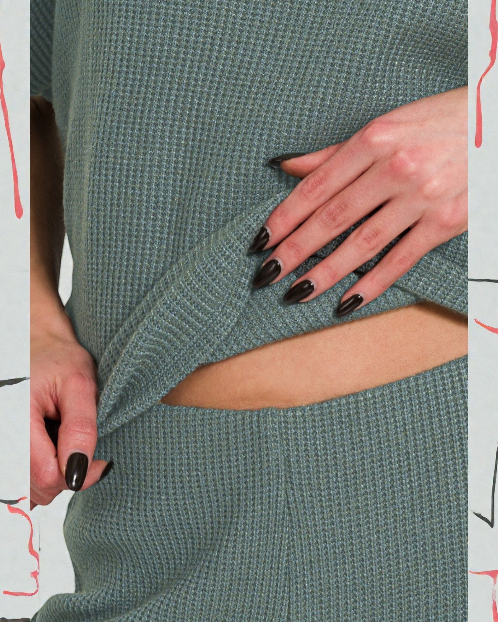 Green knit dress with cut-out design and black nail polish on hands