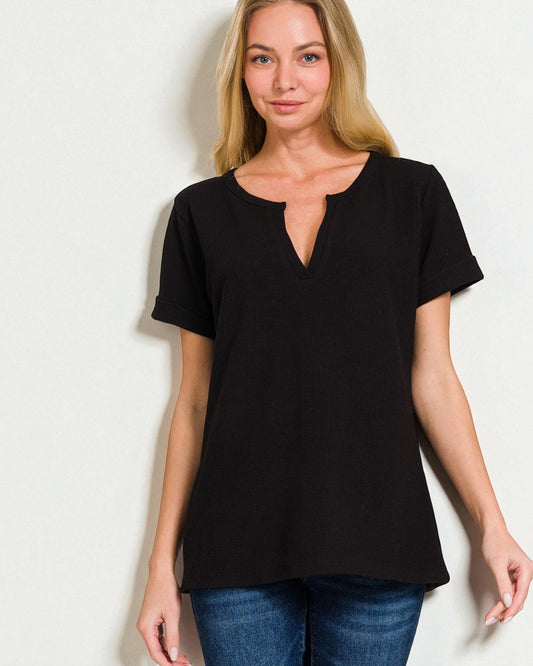 Woman wearing a black t-shirt against a white background