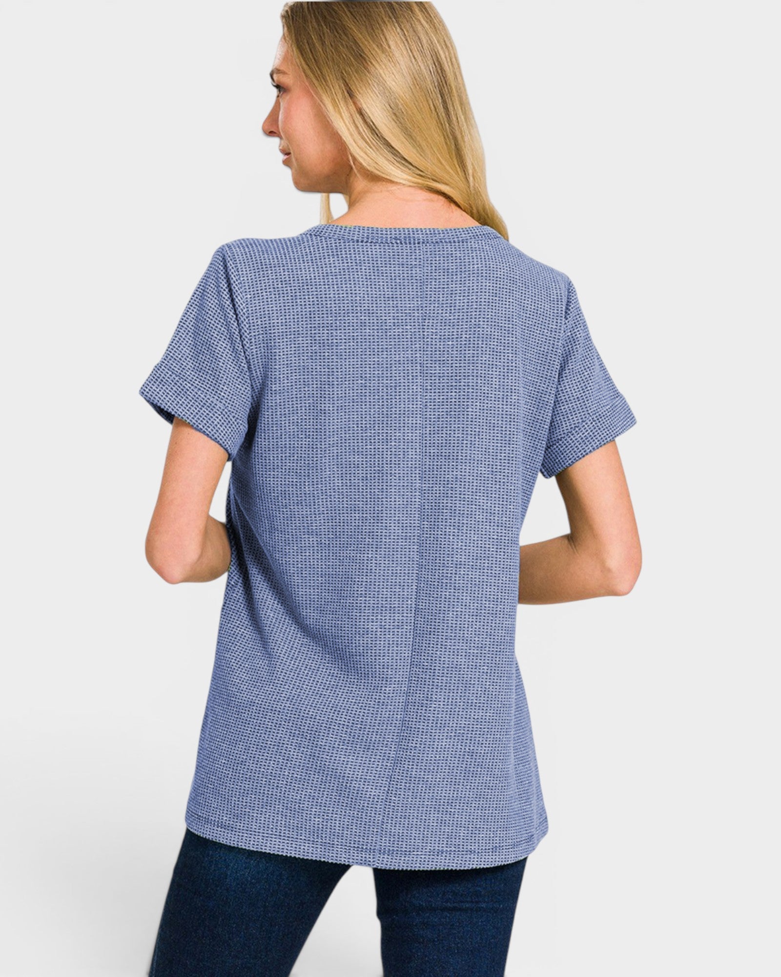 Woman wearing a blue checkered shirt on a white background