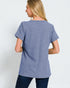 Woman wearing a blue checkered shirt against a white background