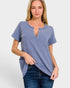 Woman wearing a blue checkered top and jeans on a white background
