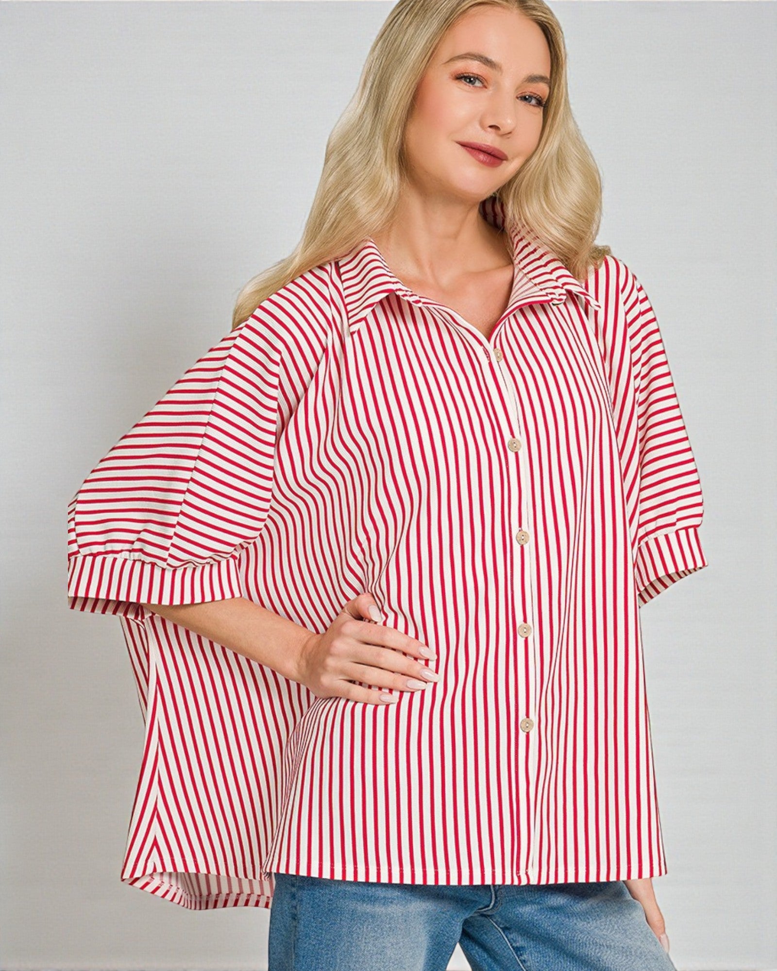 Woman wearing a red and white striped shirt against a gray background