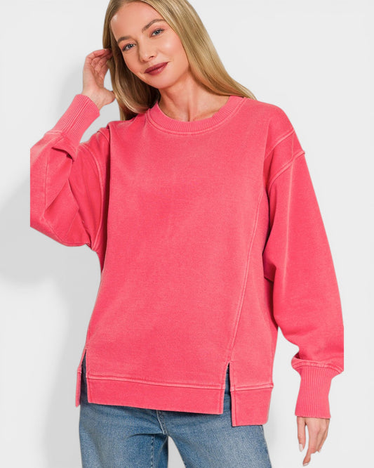 Woman wearing a pink sweatshirt against a white background