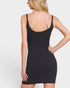 Black slip dress worn by a model on a plain background