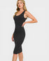 Woman wearing a black sleeveless dress on a white background