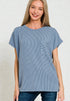 Woman wearing a blue striped tunic with a pocket on a plain background