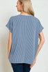 Woman wearing a blue striped shirt from behind on a plain background