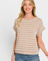 Woman wearing a beige and white striped short-sleeve top on a plain background
