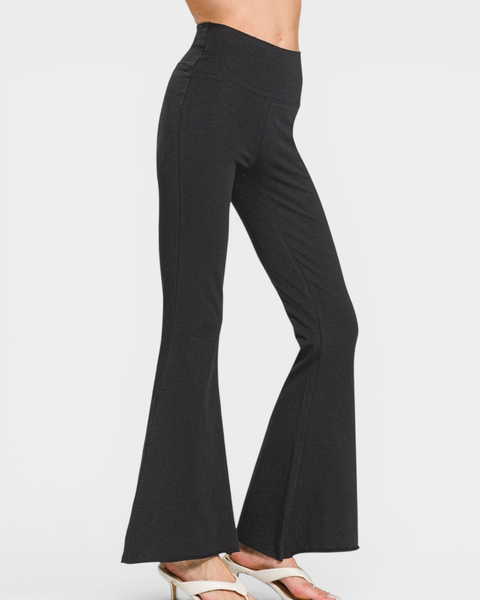 Black flared pants on a white background