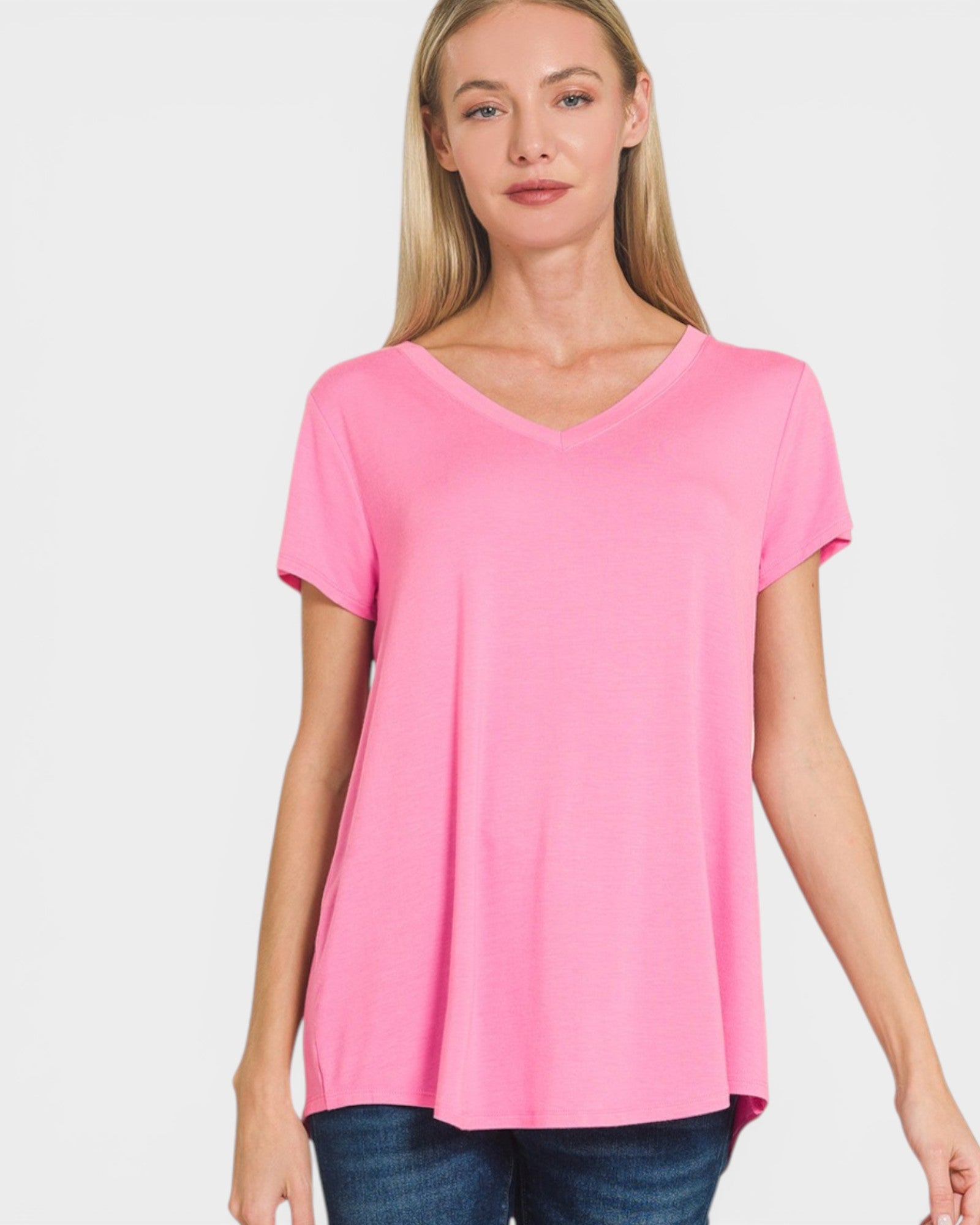 Woman wearing a pink t-shirt on a white background