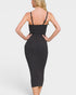 Black dress worn by a person on a white background