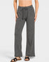 Person wearing gray lounge pants on a white background