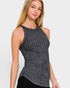 Woman wearing a gray ribbed tank top against a white background