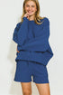 Person wearing a blue outfit on a white background