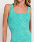 Teal tank top worn by a person on a plain background