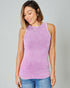Woman wearing a purple ribbed tank top against a gray background