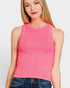 Woman wearing a pink ribbed tank top against a white background