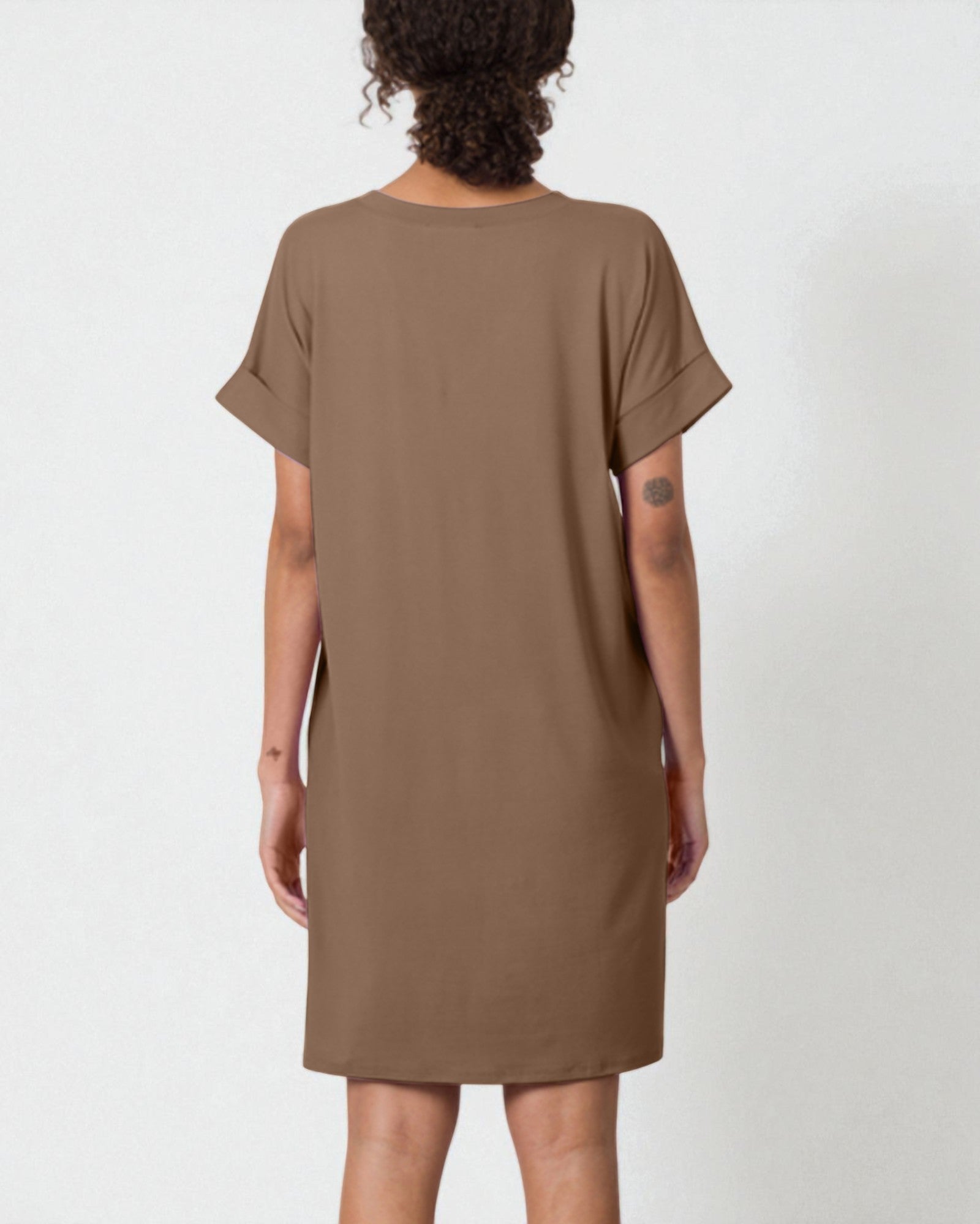 Brown dress worn by a person on a white background