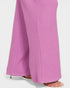Close-up of pink ribbed pants on a white background