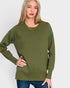 Woman wearing a green sweater with white background