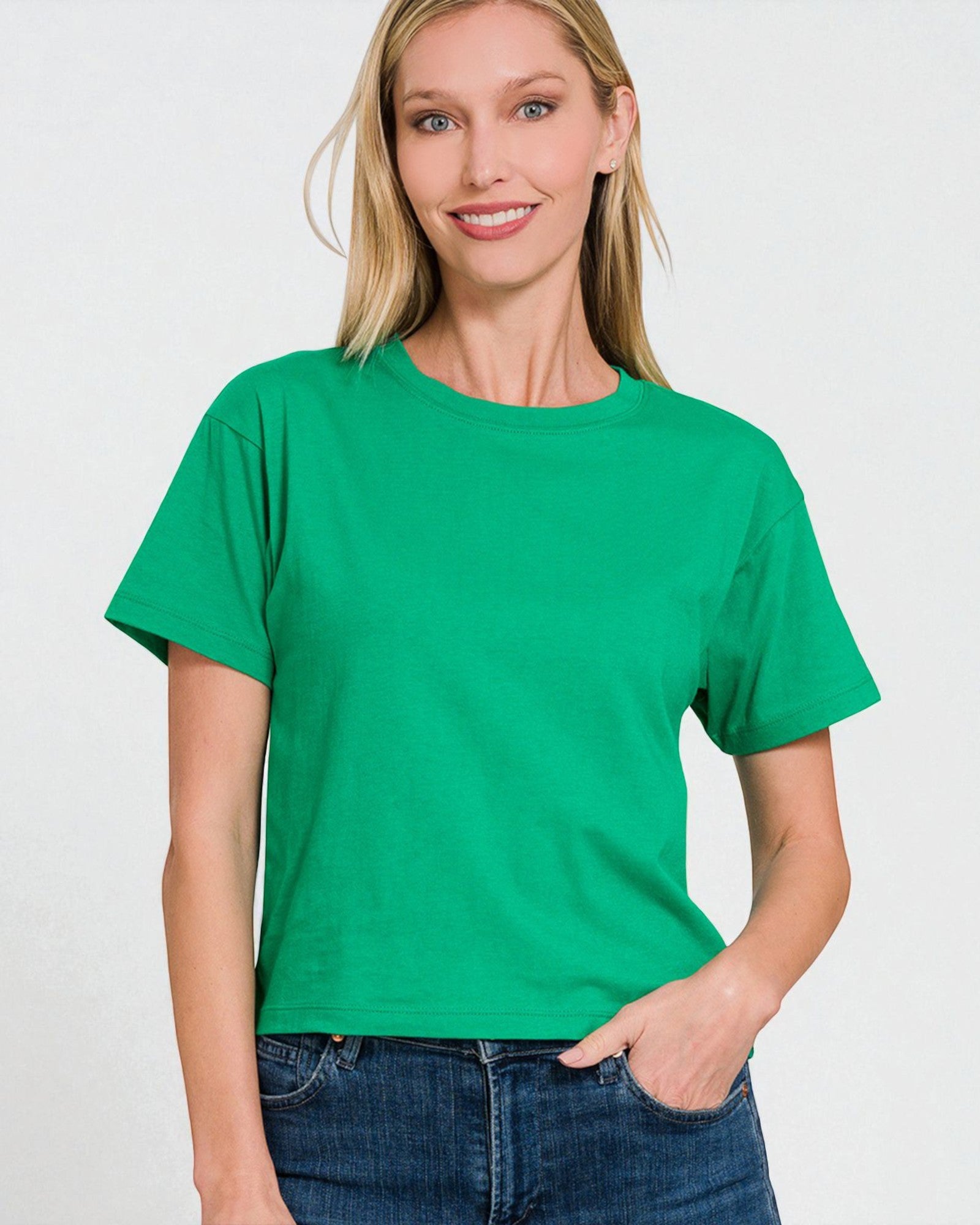 Woman wearing a green t-shirt against a white background