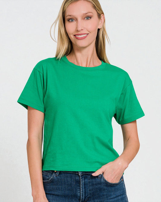 Woman wearing a green t-shirt against a white background