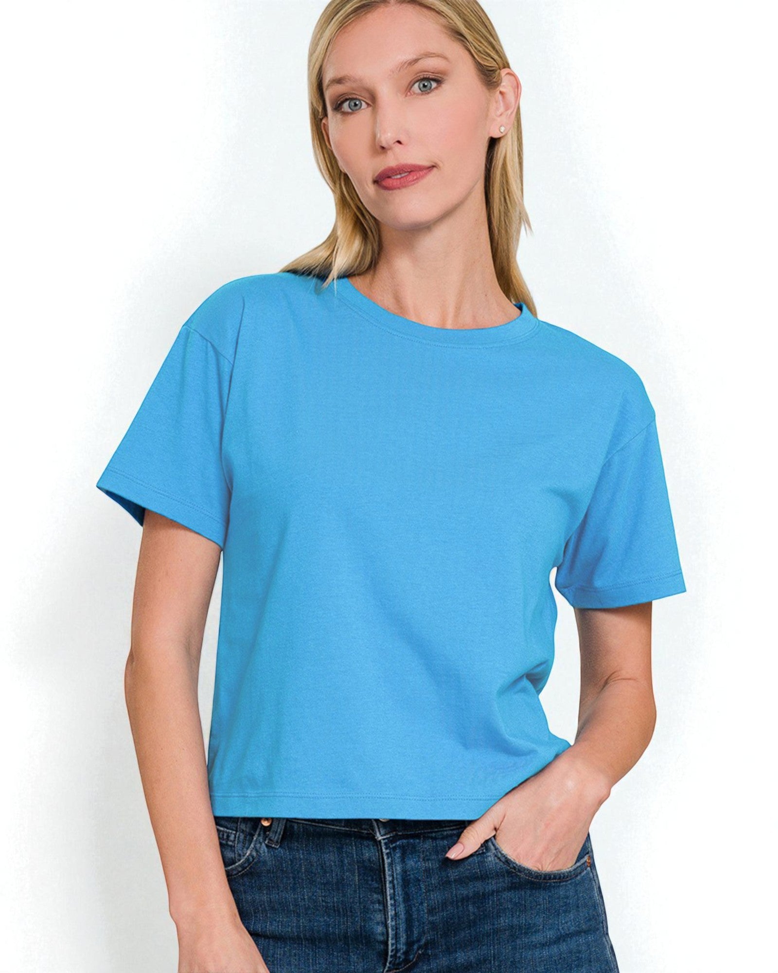 Woman wearing a blue t-shirt against a white background