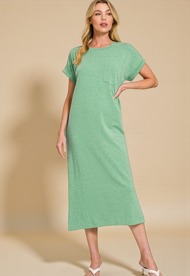 Woman wearing a green dress against a beige background