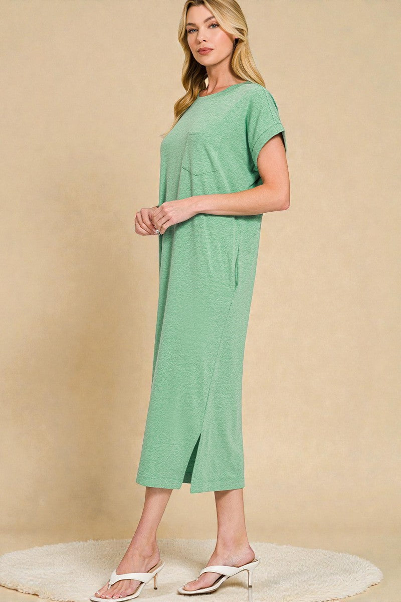 Woman wearing a green dress against a beige background