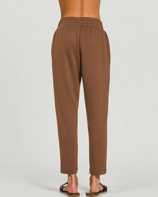 Brown sweatpants on a plain background