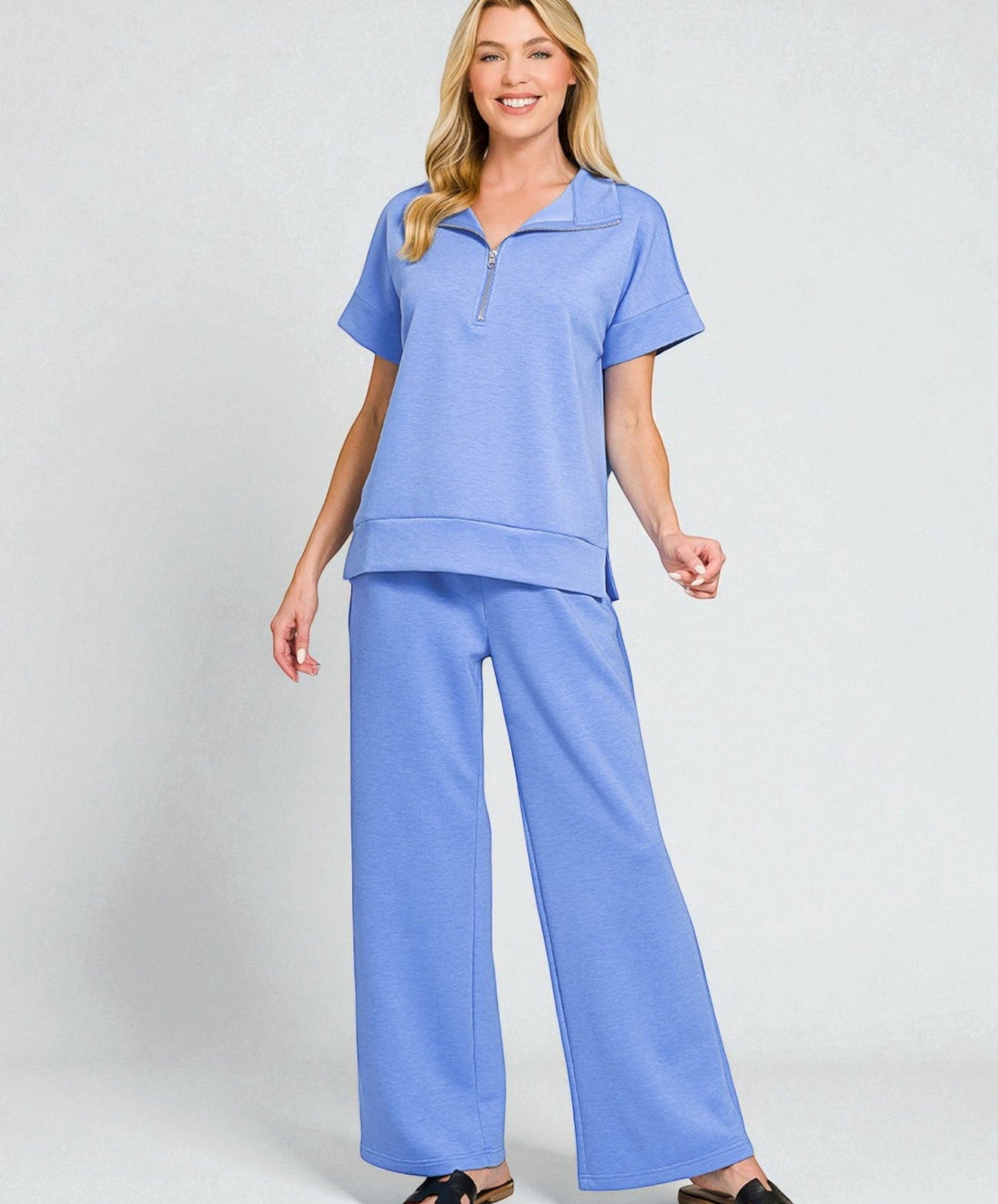 Woman wearing a blue outfit on a white background