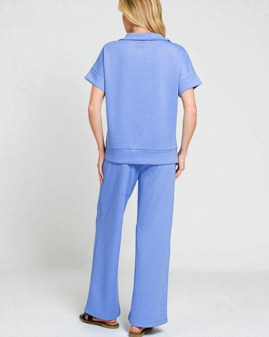 Woman wearing a blue outfit with a white background