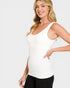 Woman wearing a white tank top against a plain background