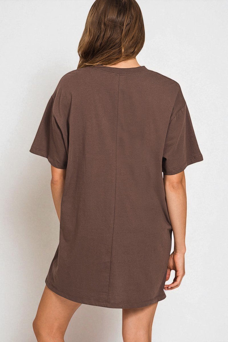 Brown t-shirt dress worn by a person on a white background