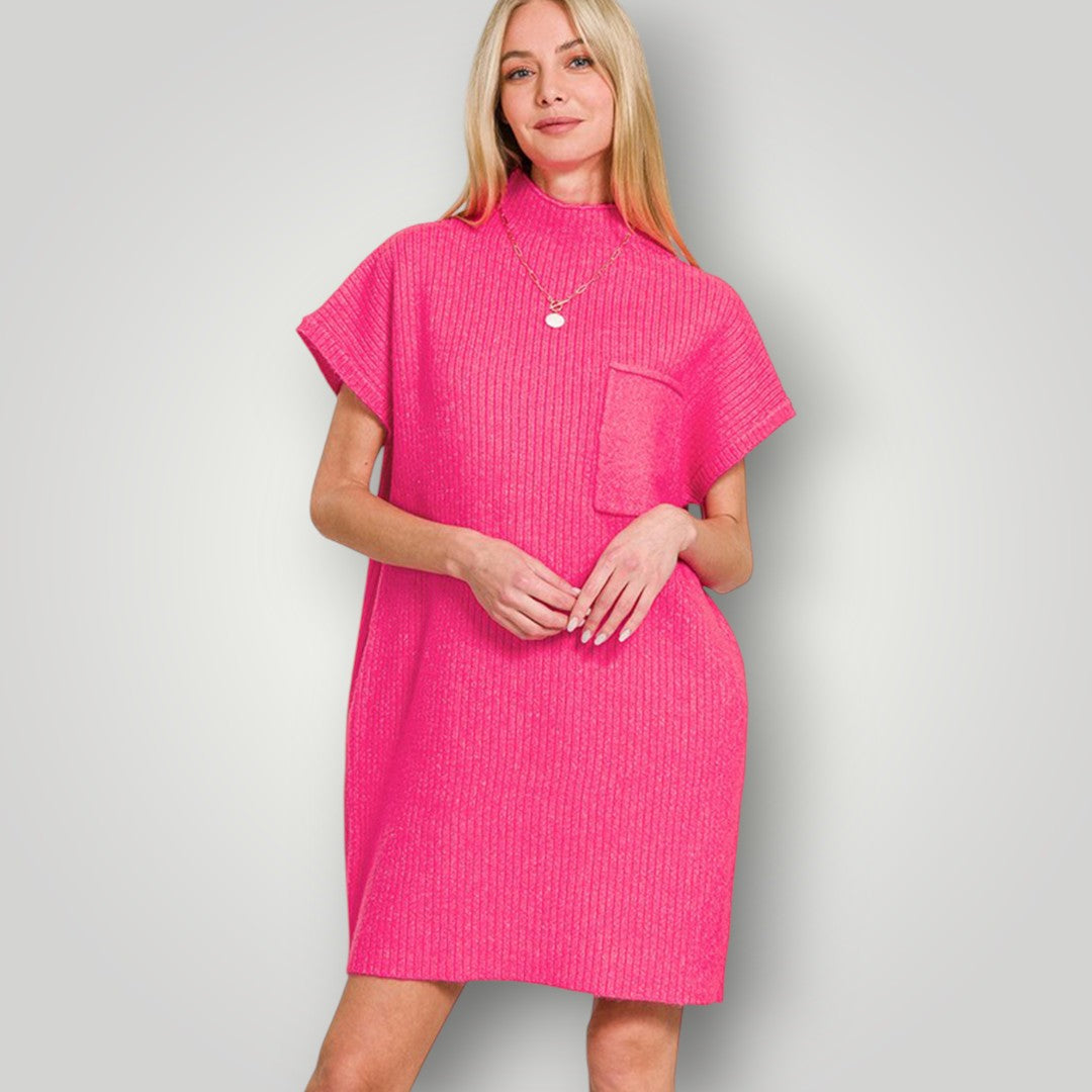 Woman wearing a bright pink dress against a plain background