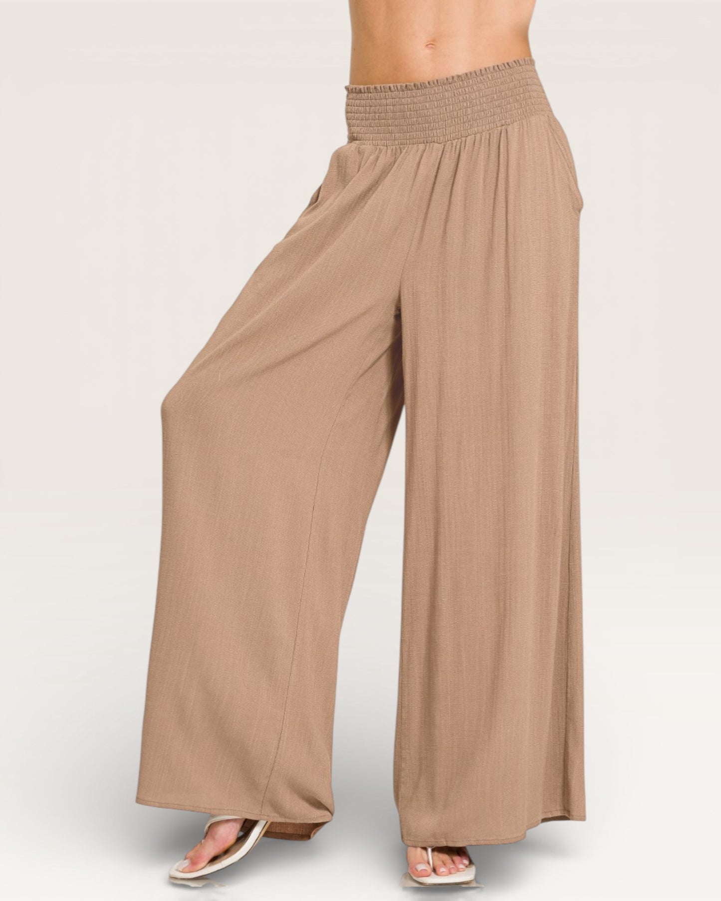 Brown wide-leg pants on a plain background