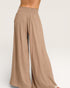 Beige wide-leg pants on a plain background